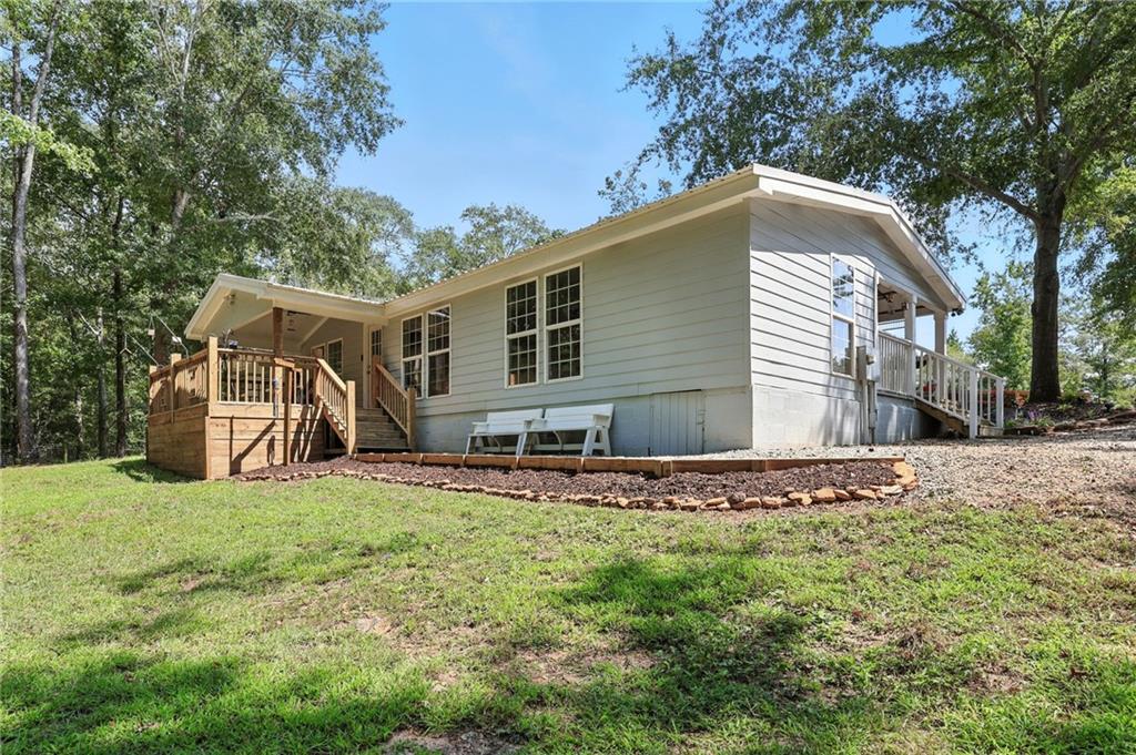 731 Borders Road Commerce, GA 30530 - Photo 47 of 75 a house with trees in the background