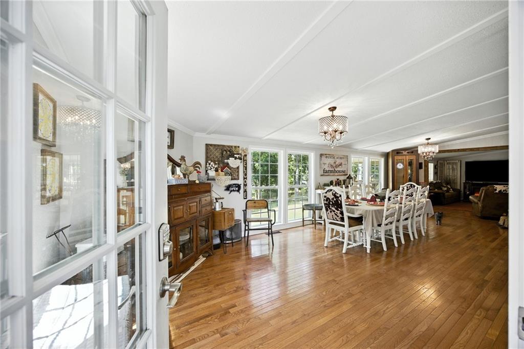 731 Borders Road Commerce, GA 30530 - Photo 54 of 75 a dining room with furniture water view and a chandelier