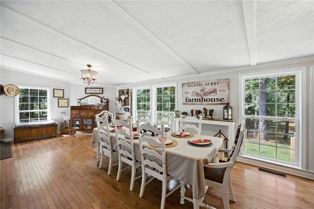 731 Borders Road Commerce, GA 30530 - Photo 56 of 75 a view of a dining room with furniture window and wooden floor