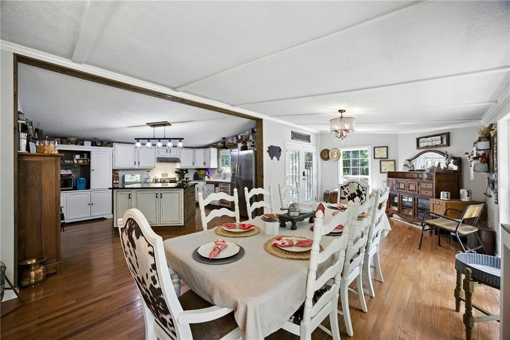 731 Borders Road Commerce, GA 30530 - Photo 57 of 75 a view of a dining room with furniture and wooden floor