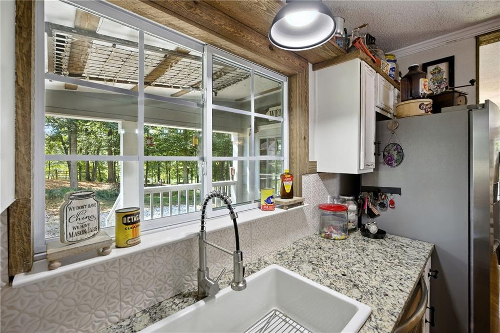 731 Borders Road Commerce, GA 30530 - Photo 59 of 75 a view of a kitchen with a sink and breakfast area