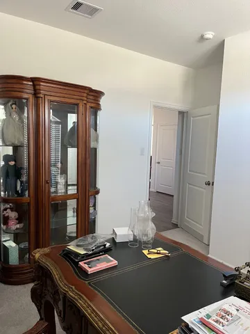 a workspace with furniture and window