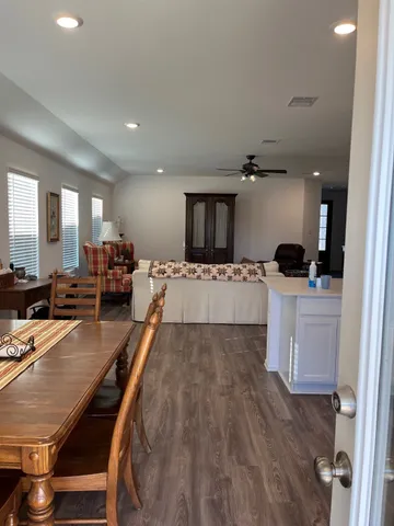 a large white kitchen with a large window