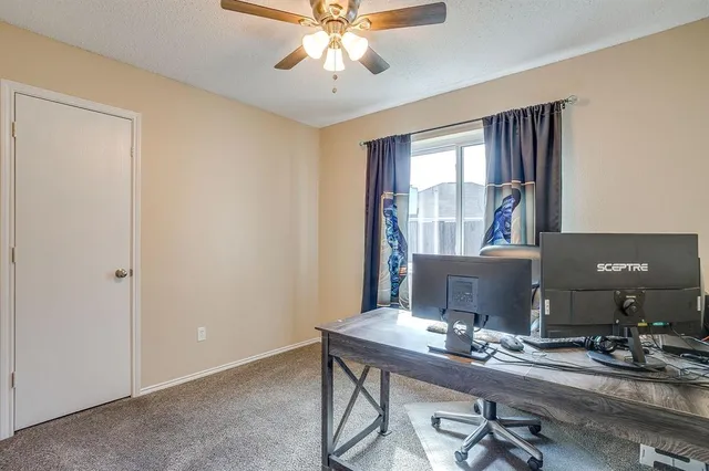 a workspace with furniture and window