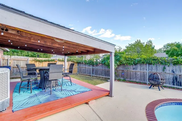 a view of swimming pool with a patio