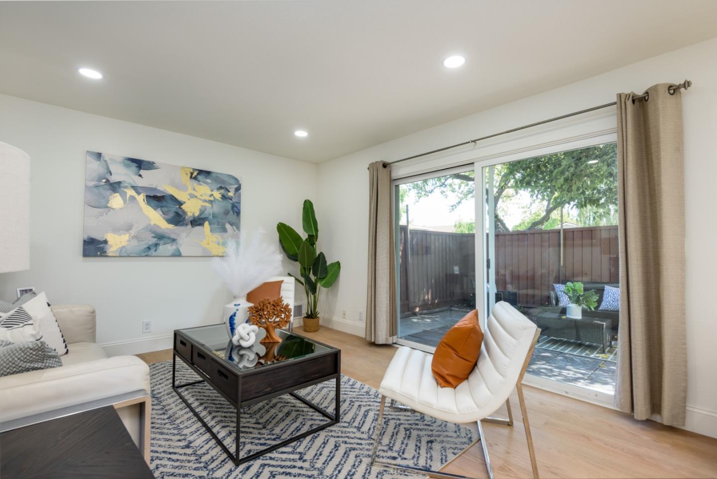 1107 Reed Avenue, Unit B Sunnyvale, CA 94086 - Photo 3 of 21 a living room with furniture and a large window