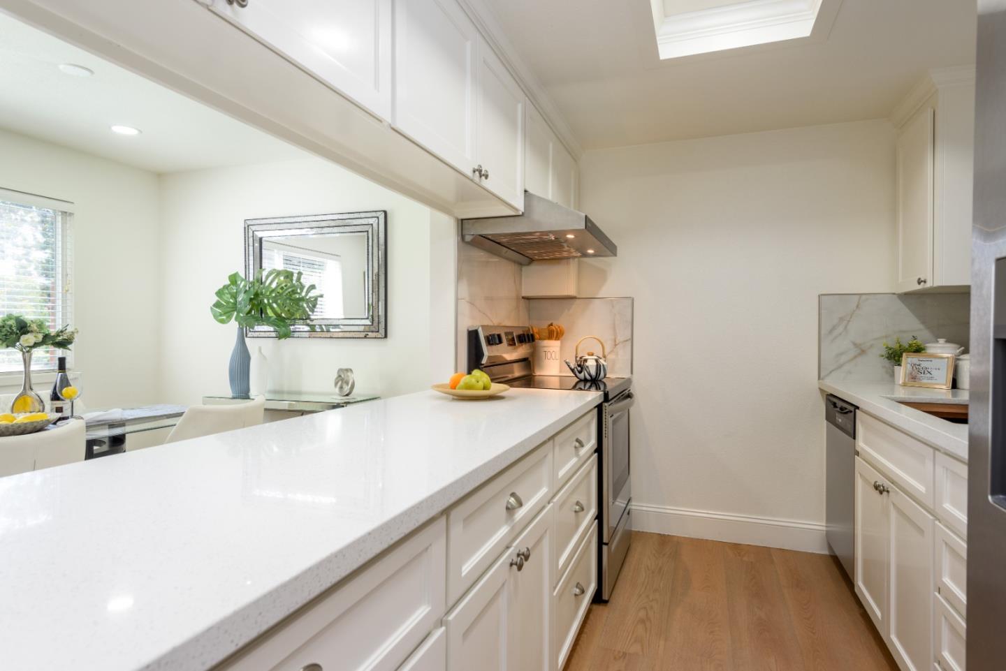 1107 Reed Avenue, Unit B Sunnyvale, CA 94086 - Photo 5 of 21 a kitchen with a sink and cabinets