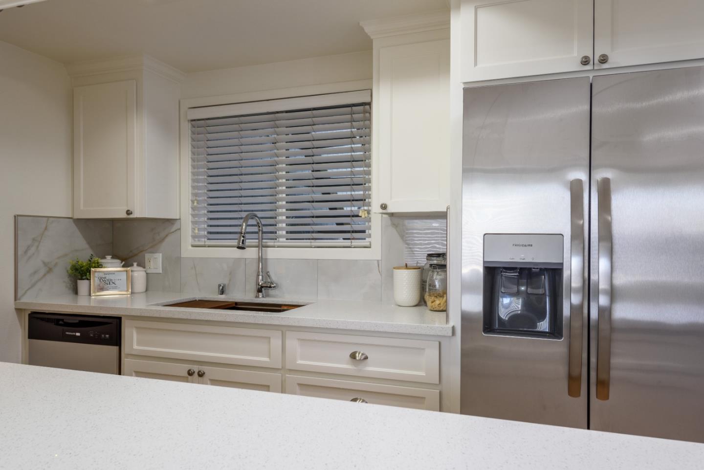 1107 Reed Avenue, Unit B Sunnyvale, CA 94086 - Photo 7 of 21 a kitchen with a refrigerator and a sink