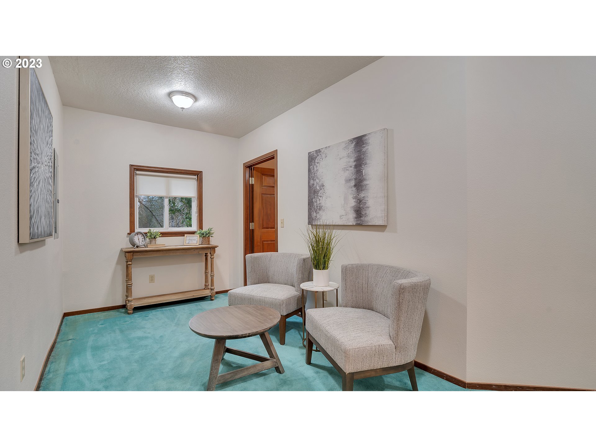660 Southwest Maplecrest Drive Portland, OR 97219 - Photo 11 of 32 a living room with furniture and a window