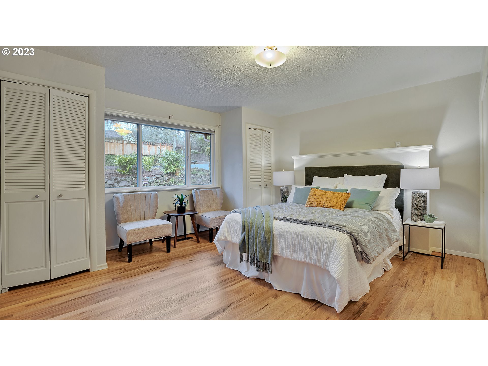 660 Southwest Maplecrest Drive Portland, OR 97219 - Photo 23 of 32 a living room with a bed furniture and a window