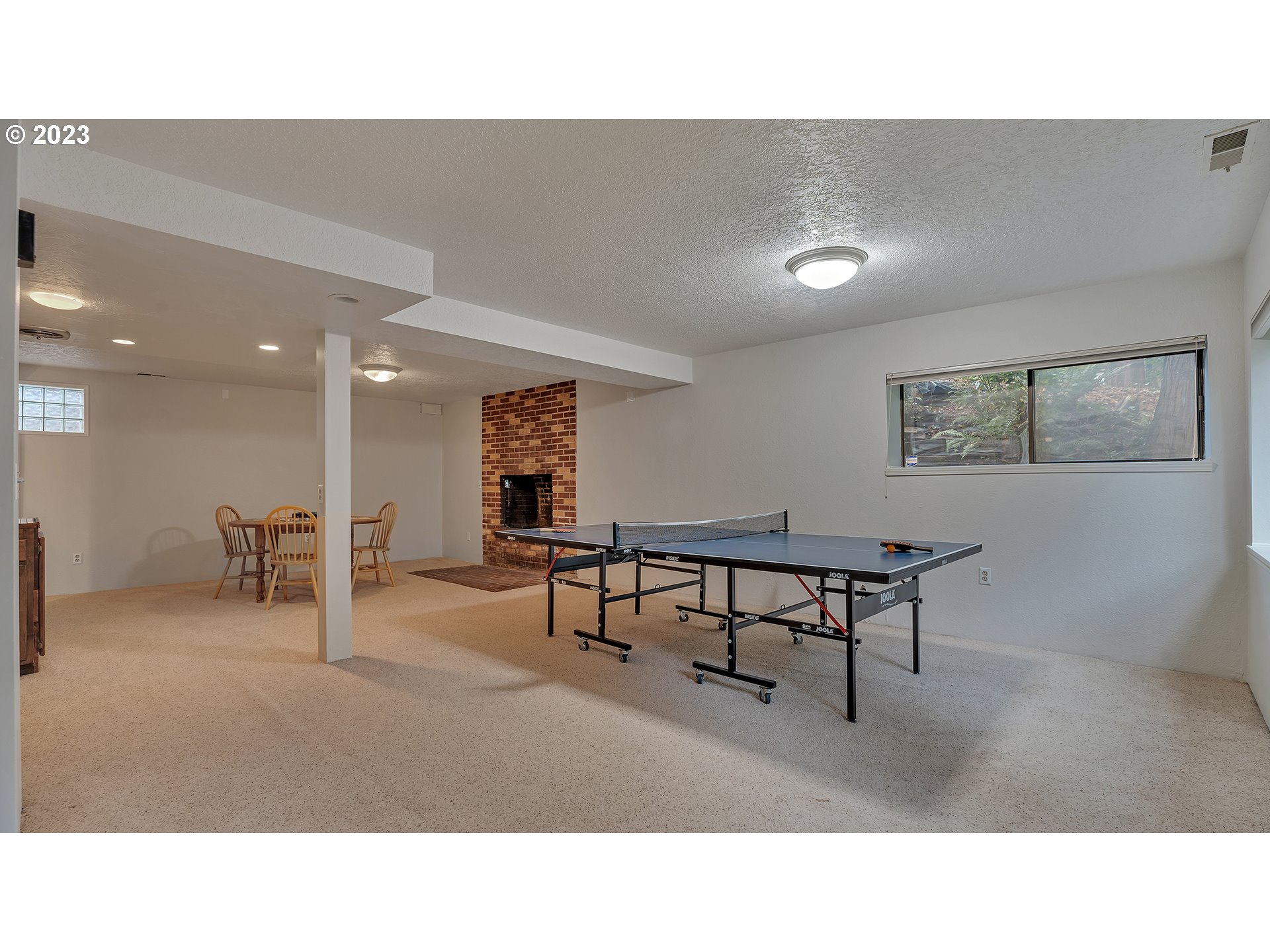 660 Southwest Maplecrest Drive Portland, OR 97219 - Photo 29 of 32 a living room with furniture and a wooden floor