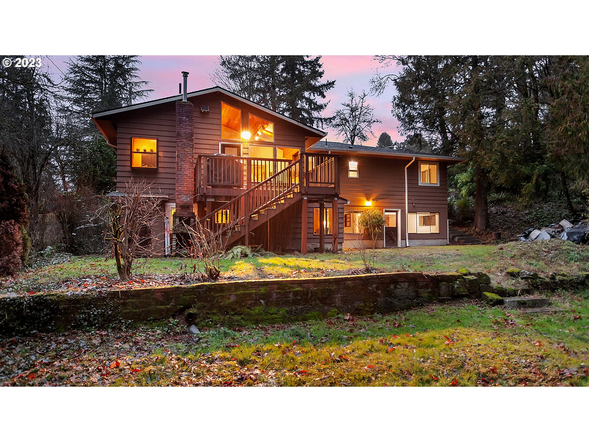 660 Southwest Maplecrest Drive Portland, OR 97219 - Photo 3 of 32 a view of a house with a yard