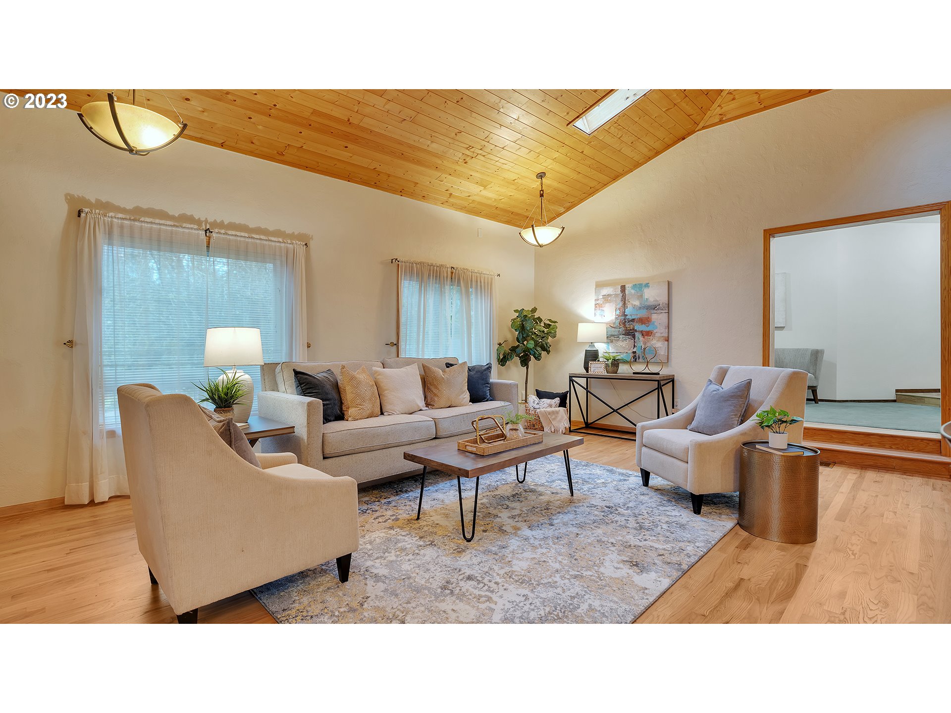 660 Southwest Maplecrest Drive Portland, OR 97219 - Photo 6 of 32 a living room with furniture and a wooden floor