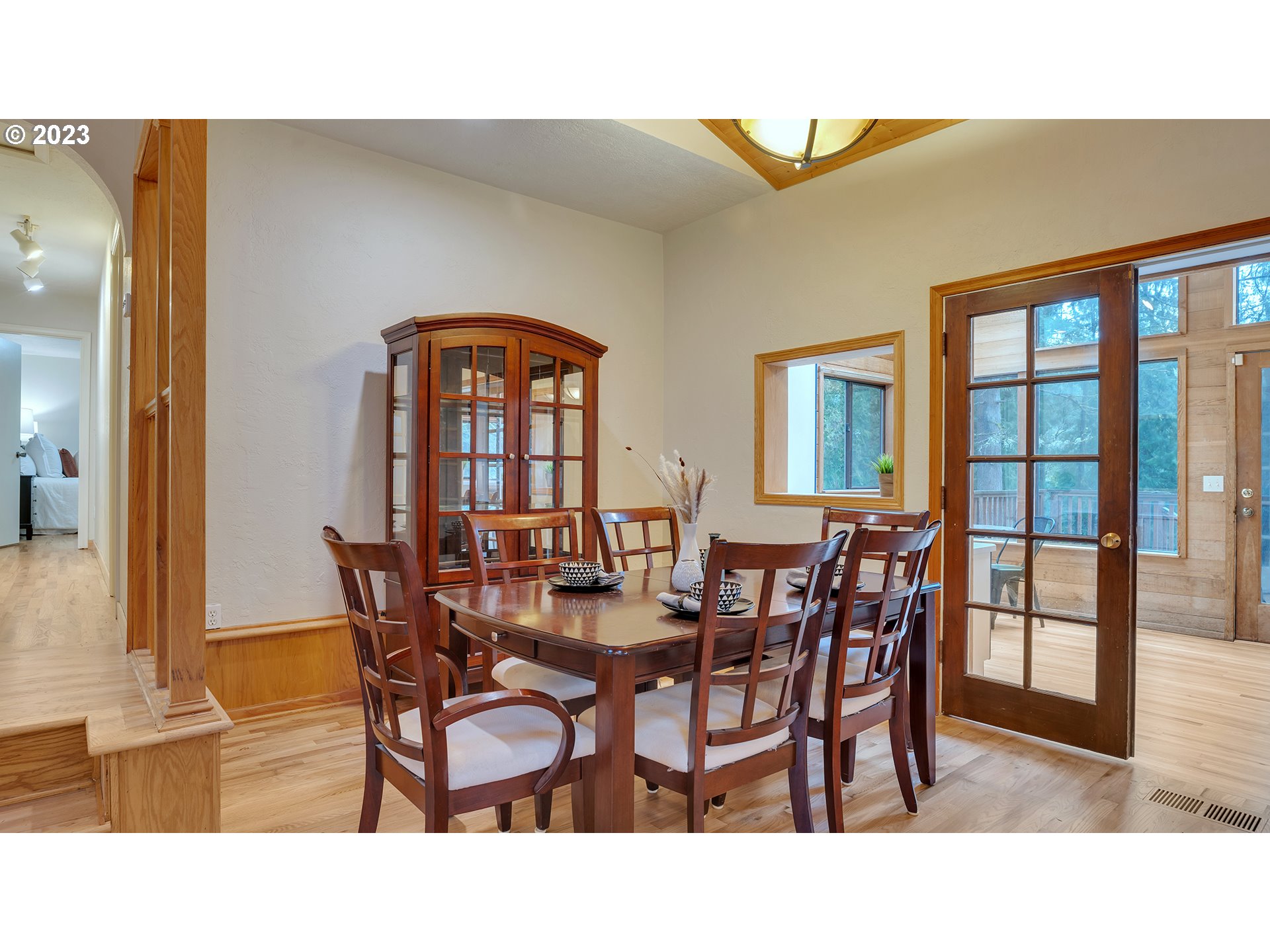 660 Southwest Maplecrest Drive Portland, OR 97219 - Photo 8 of 32 a view of a dining room with furniture and a chandelier