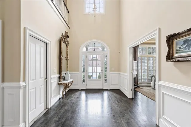 a view of an entryway with wooden floor
