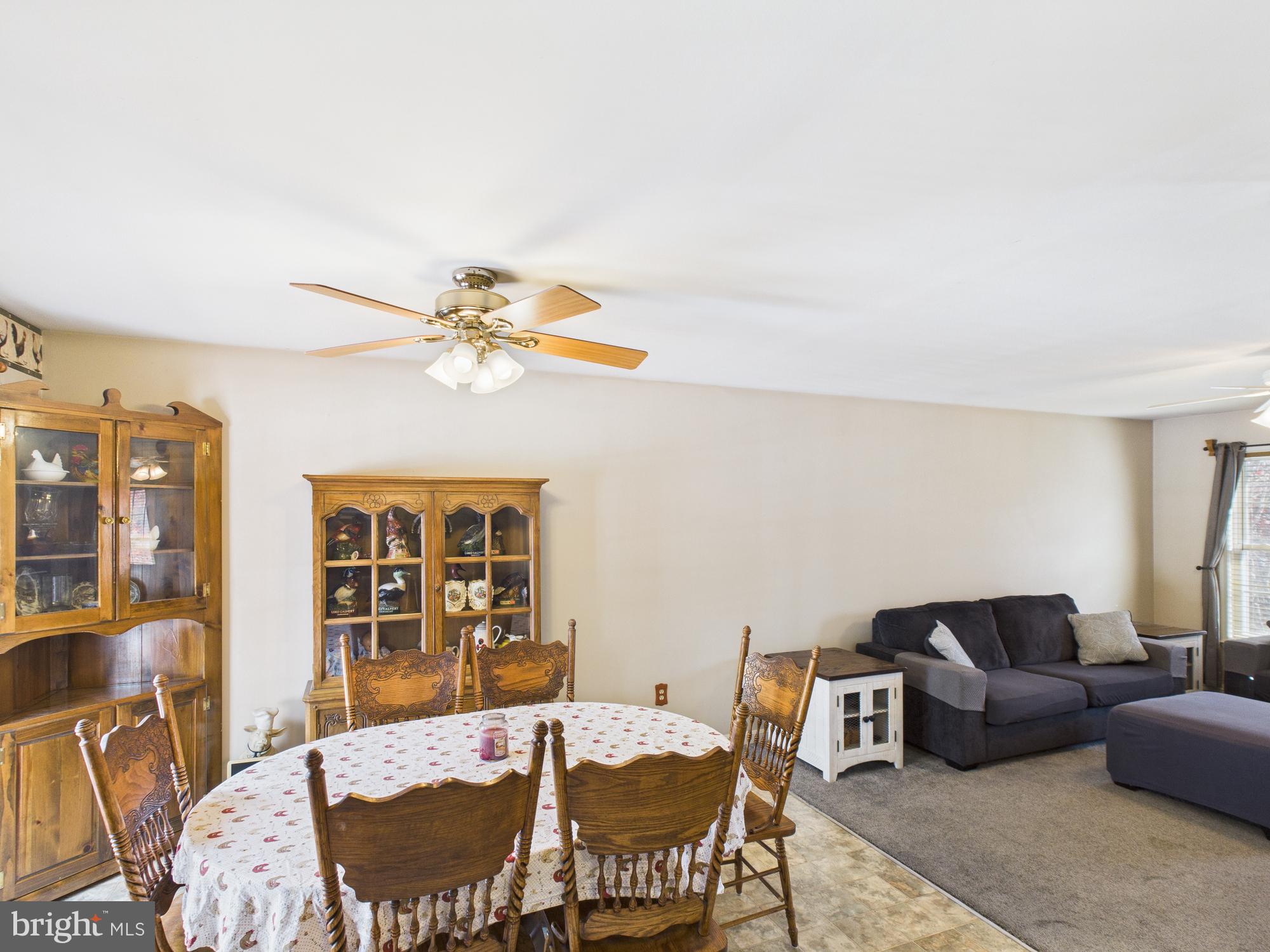 64 Bancroft Street Taneytown, MD 21787 - Photo 12 of 29 a living room with furniture and wooden floor