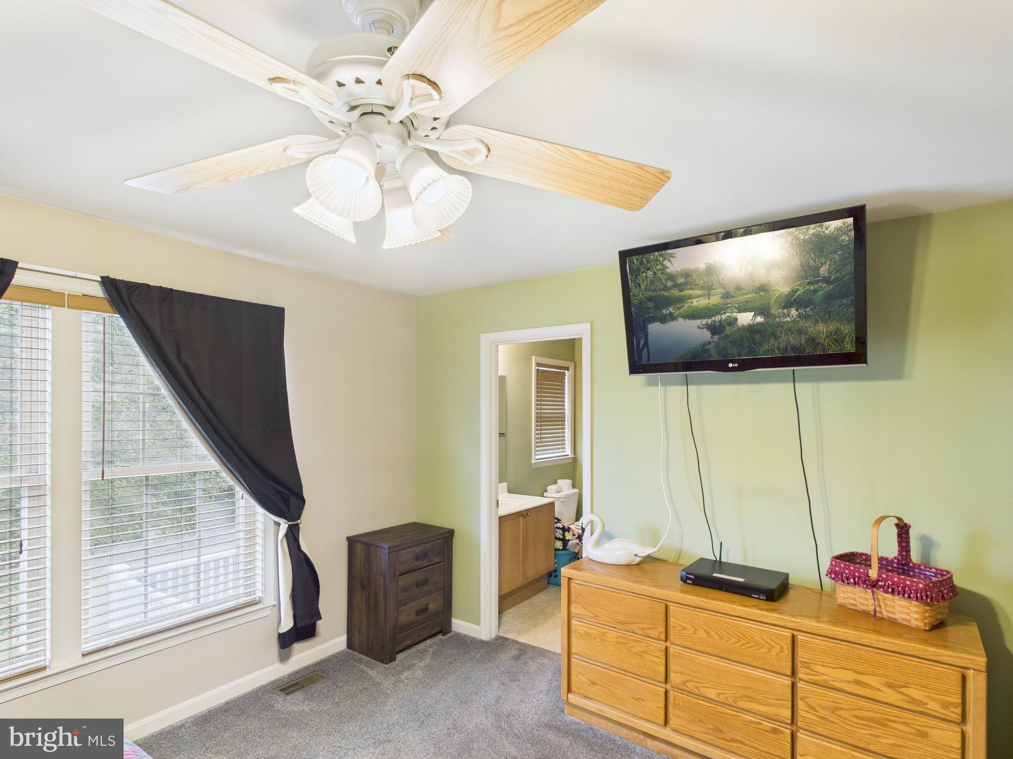 64 Bancroft Street Taneytown, MD 21787 - Photo 17 of 29 a living room with furniture and a flat screen tv