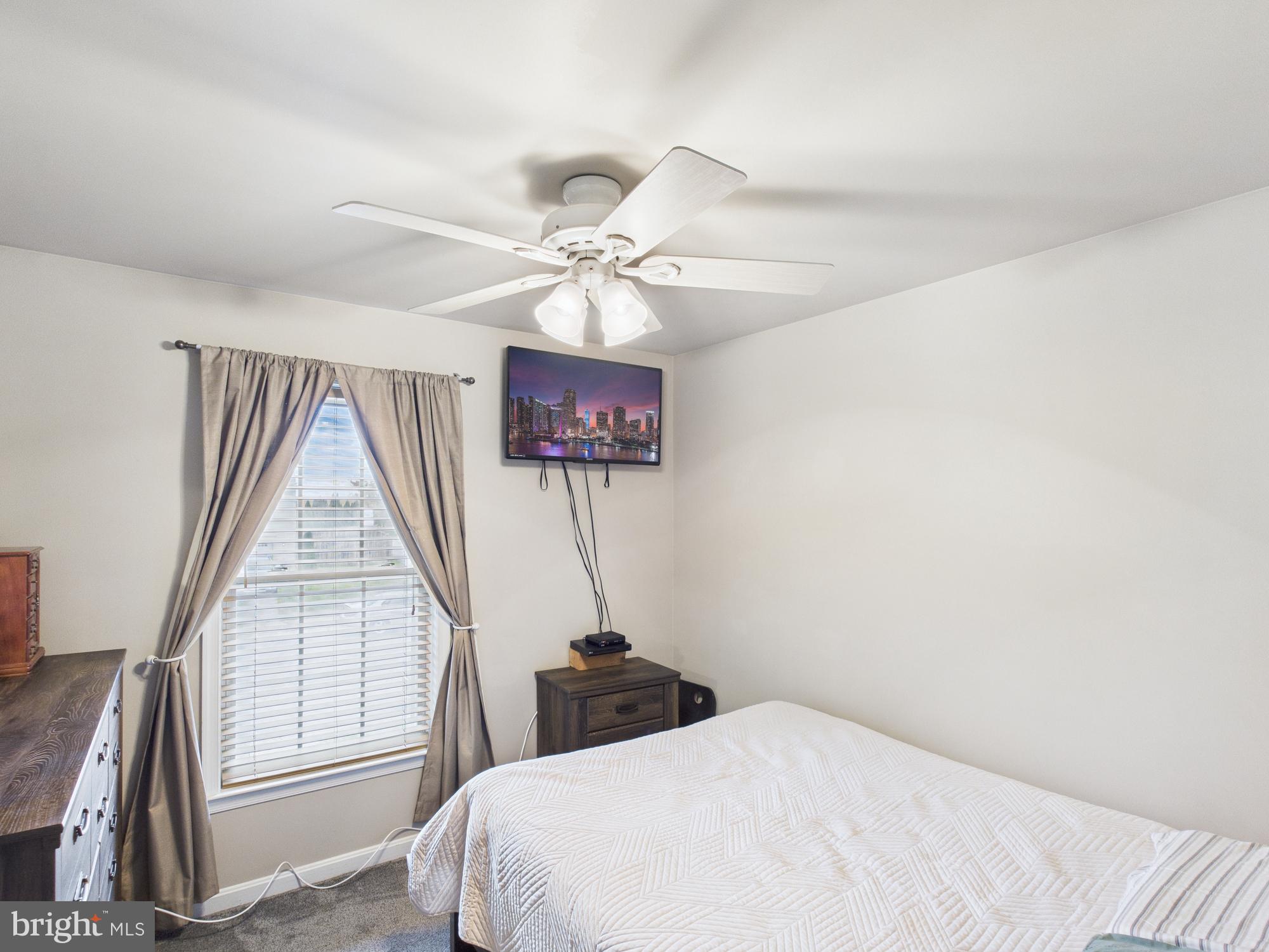 64 Bancroft Street Taneytown, MD 21787 - Photo 19 of 29 a bedroom with a bed and a large window