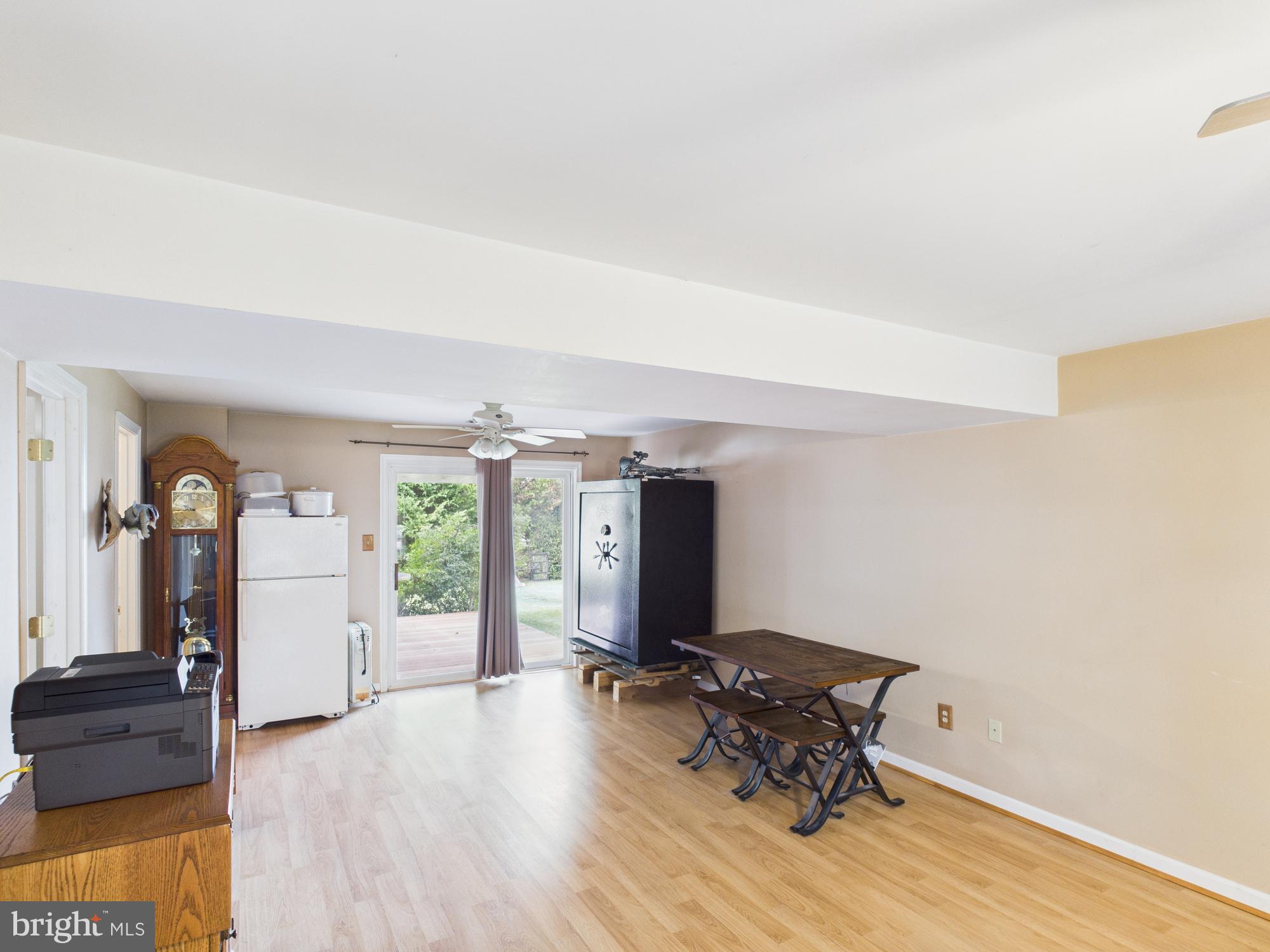 64 Bancroft Street Taneytown, MD 21787 - Photo 23 of 29 a room with furniture and wooden floor