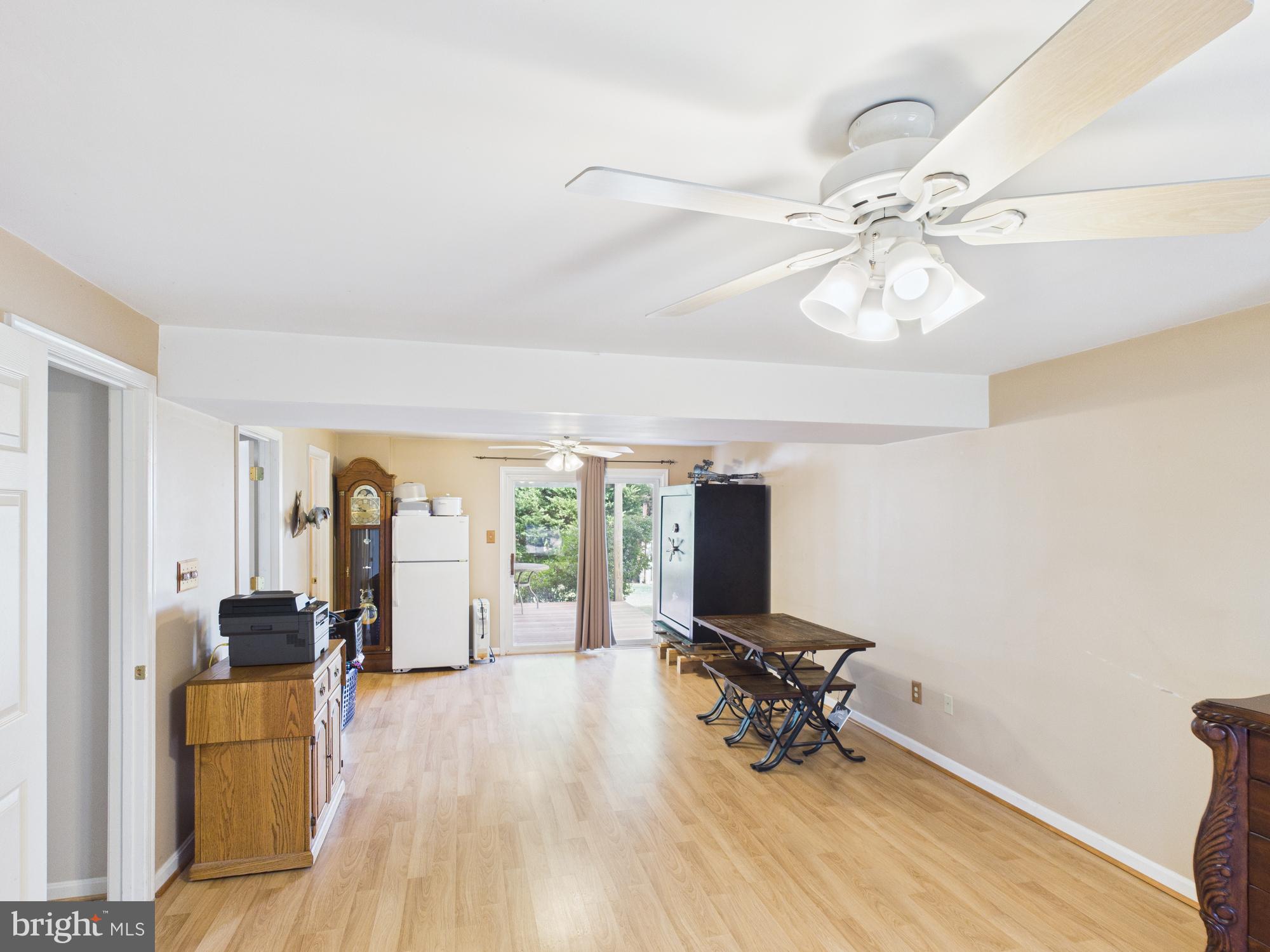 64 Bancroft Street Taneytown, MD 21787 - Photo 24 of 29 a living room with furniture and a chandelier