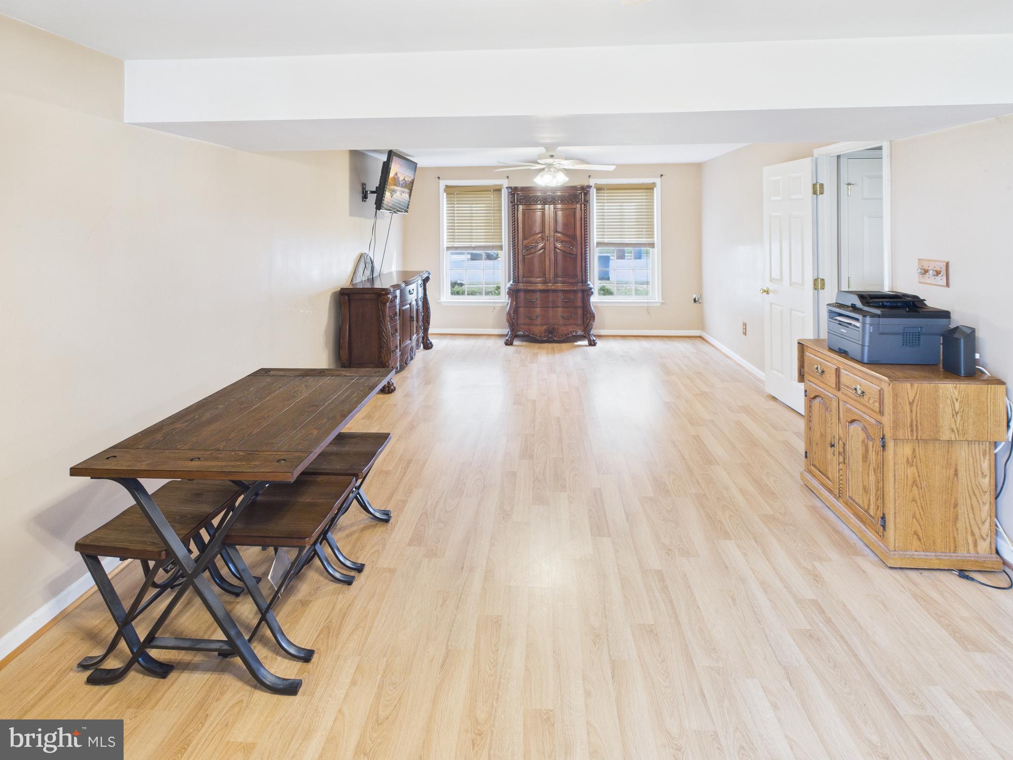 64 Bancroft Street Taneytown, MD 21787 - Photo 25 of 29 a living room with furniture and a wooden floor