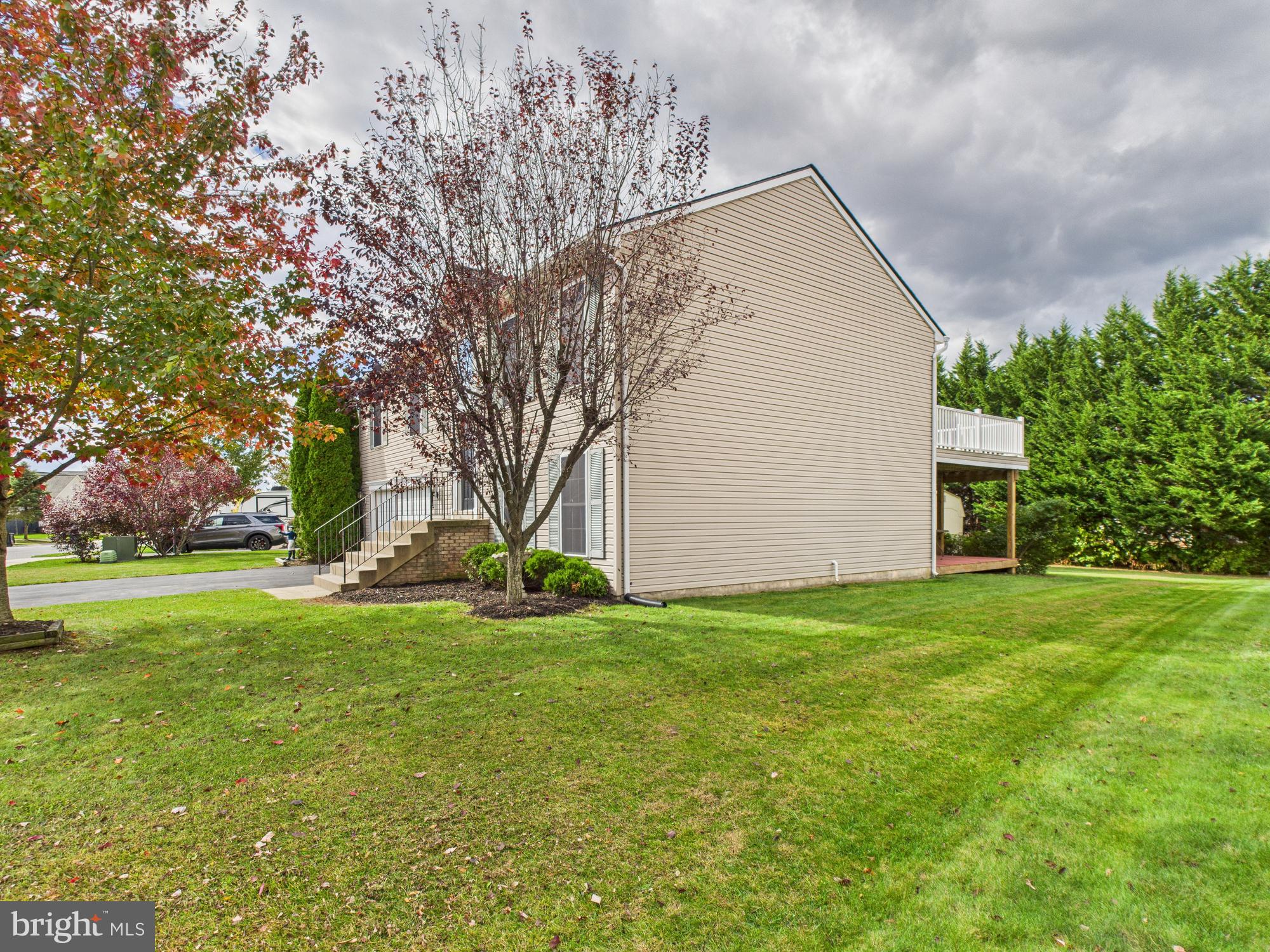 64 Bancroft Street Taneytown, MD 21787 - Photo 4 of 29 a view of a house with a yard and garage