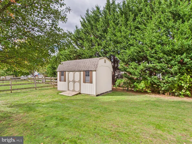 a view of a tiny house with a yard