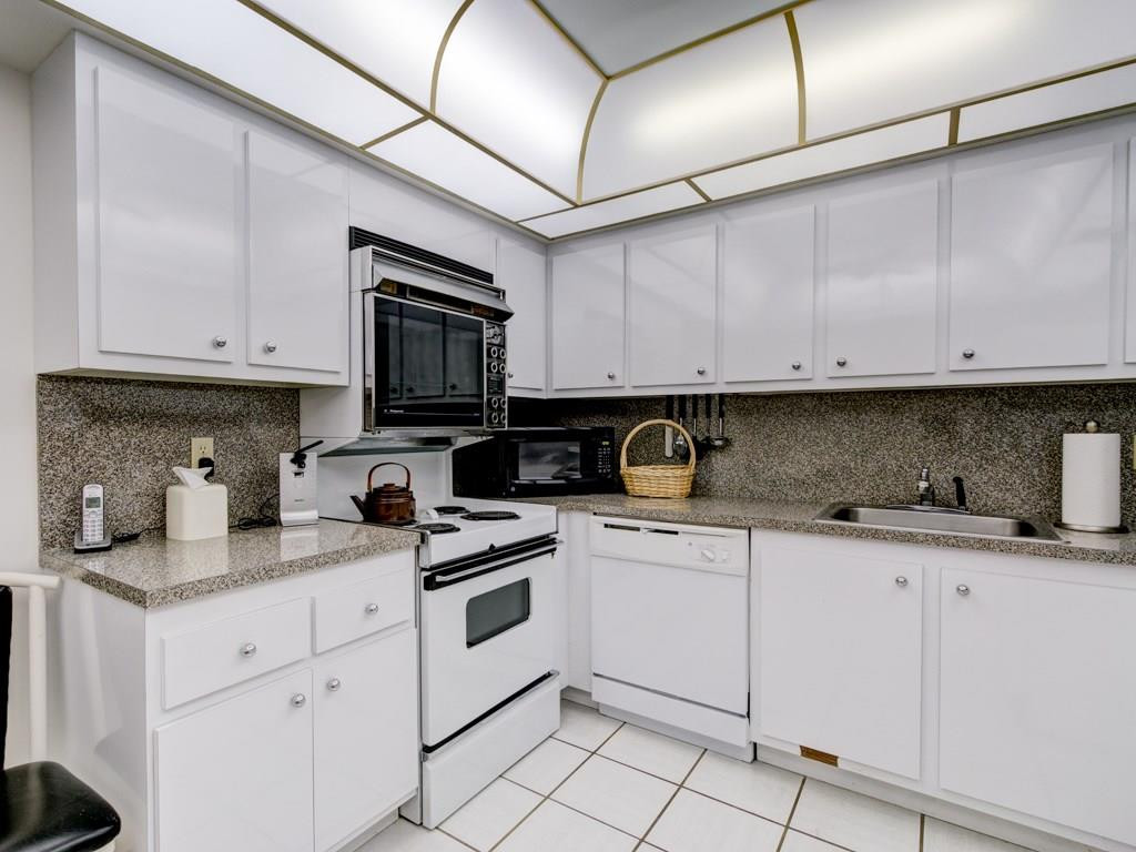 16400 Golf Club Road, Unit 204 Weston, FL 33326 - Photo 16 of 31 a kitchen with granite countertop cabinets stainless steel appliances and a sink