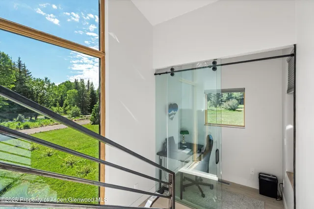 a view of a room with a large window