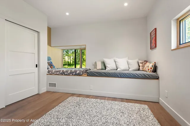 a living room with a couch and a rug