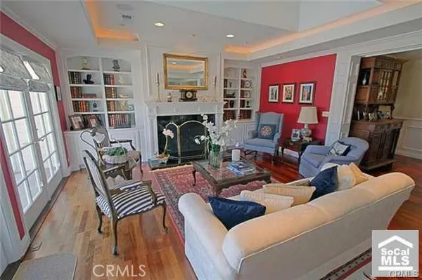 a living room with furniture a rug and a fireplace
