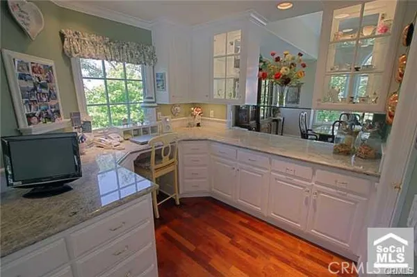 a kitchen with a sink cabinets and window