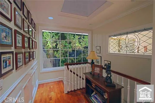 a view of a room with furniture and windows