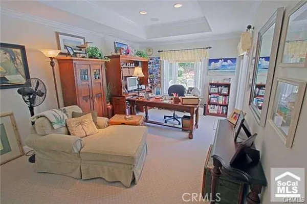 a living room with furniture cabinets and a flat screen tv