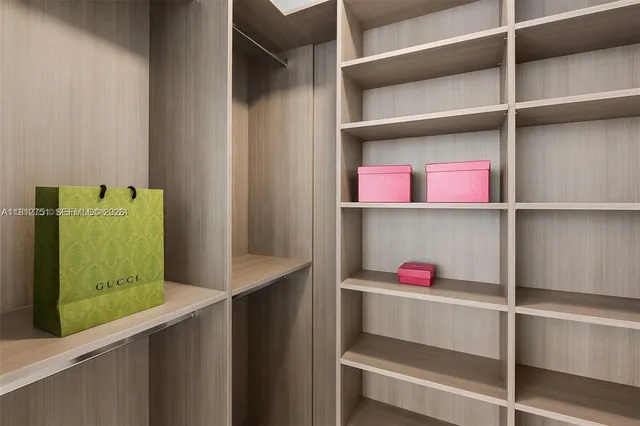 a utility room with closet and window