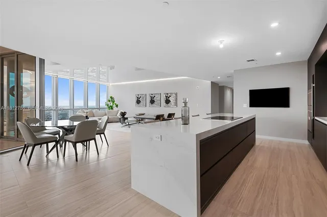 a large white kitchen with lots of counter space