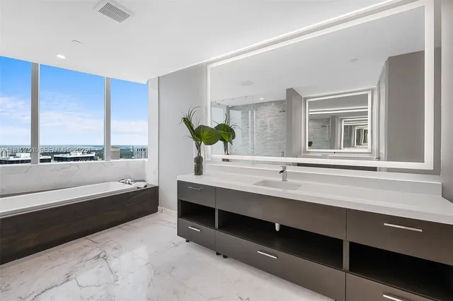 a bathroom with a bathtub and a sink