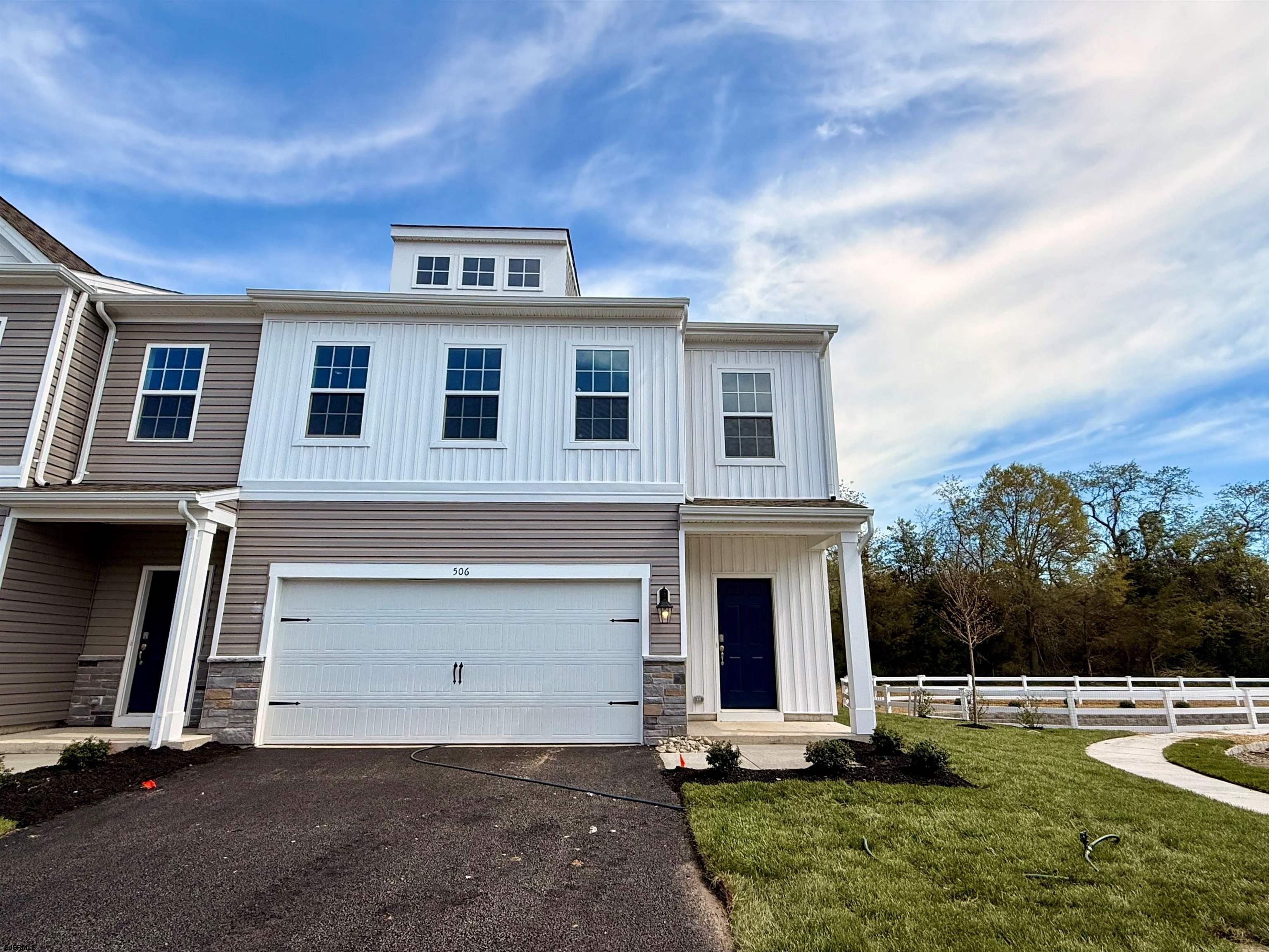506 Scotty Boulevard, Unit 1204 Rio Grande, NJ 08242 - Photo 2 of 44 a front view of a house with garden