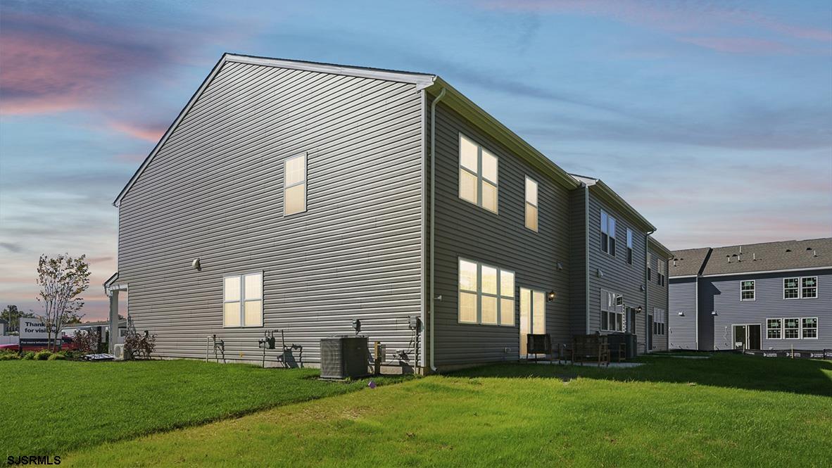 506 Scotty Boulevard, Unit 1204 Rio Grande, NJ 08242 - Photo 44 of 44 a front view of a house with a yard