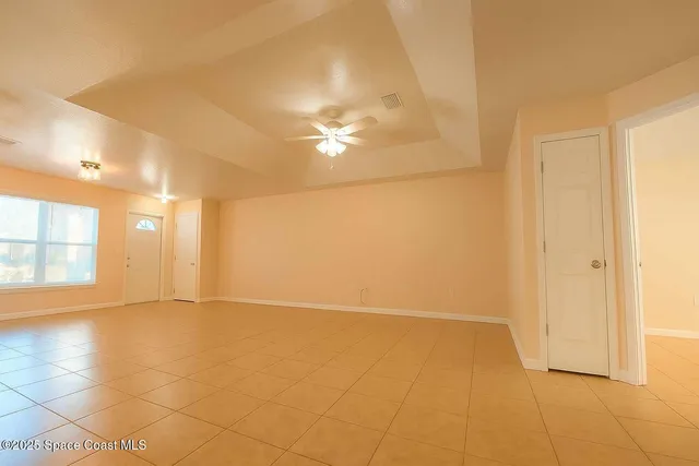 a kitchen with a stove cabinets and wooden floor