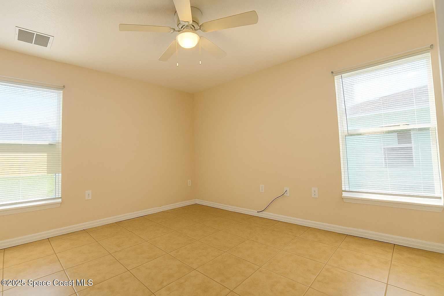 819 Angela Avenue, Unit B Rockledge, FL 32955 - Photo 8 of 11 an empty room with a window