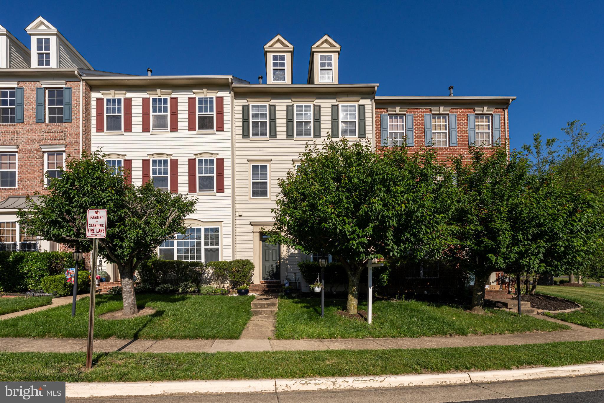 9231 Ribbon Falls Loop Bristow, VA 20136 - Photo 1 of 40 a front view of a house with a yard