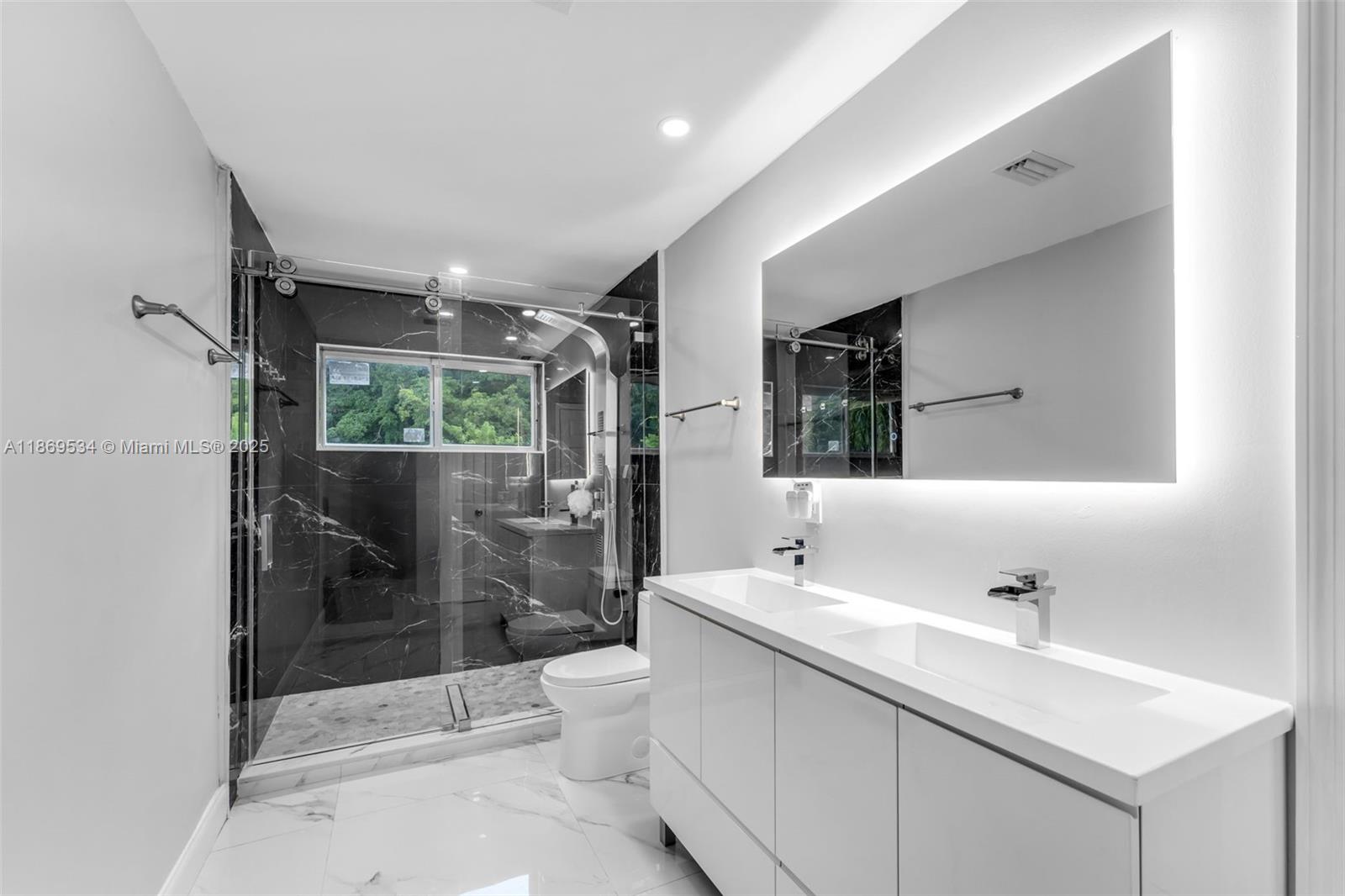 11186 Southwest 75th Terrace Miami, FL 33173 - Photo 12 of 26 a bathroom with a sink a toilet and shower