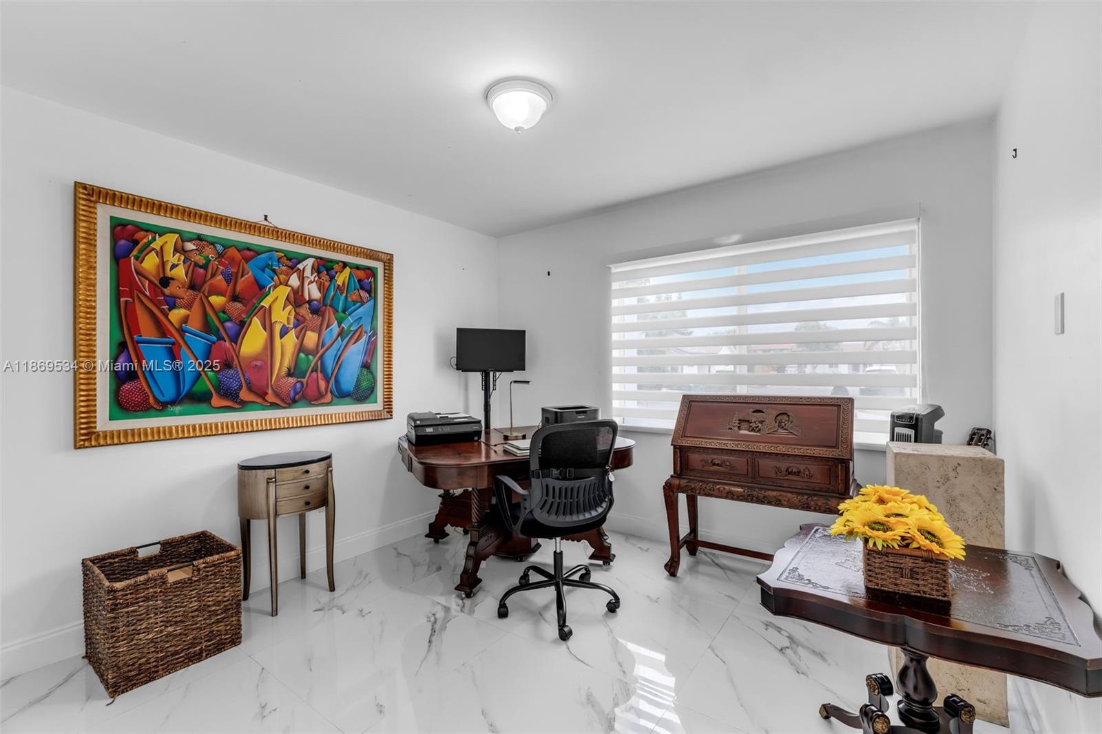 11186 Southwest 75th Terrace Miami, FL 33173 - Photo 16 of 26 a view of a workspace with furniture and a window