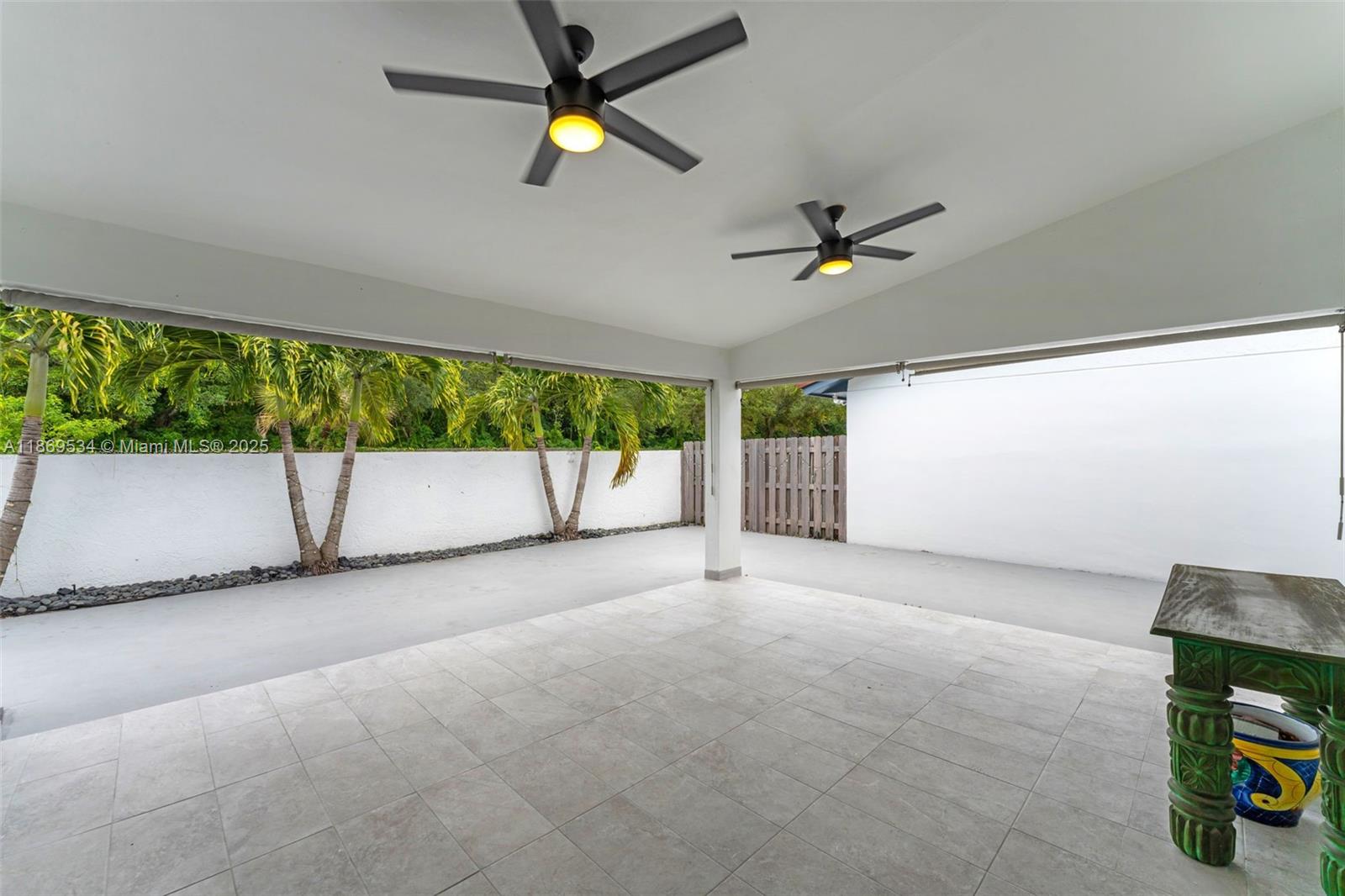 11186 Southwest 75th Terrace Miami, FL 33173 - Photo 17 of 26 an empty room with a ceiling fan and window