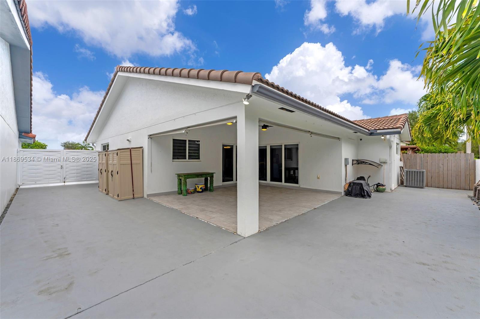 11186 Southwest 75th Terrace Miami, FL 33173 - Photo 19 of 26 a view of a house with couches and backyard