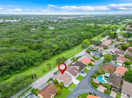 an aerial view of a house with a garden