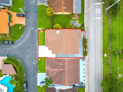 a view of an house with backyard space and balcony