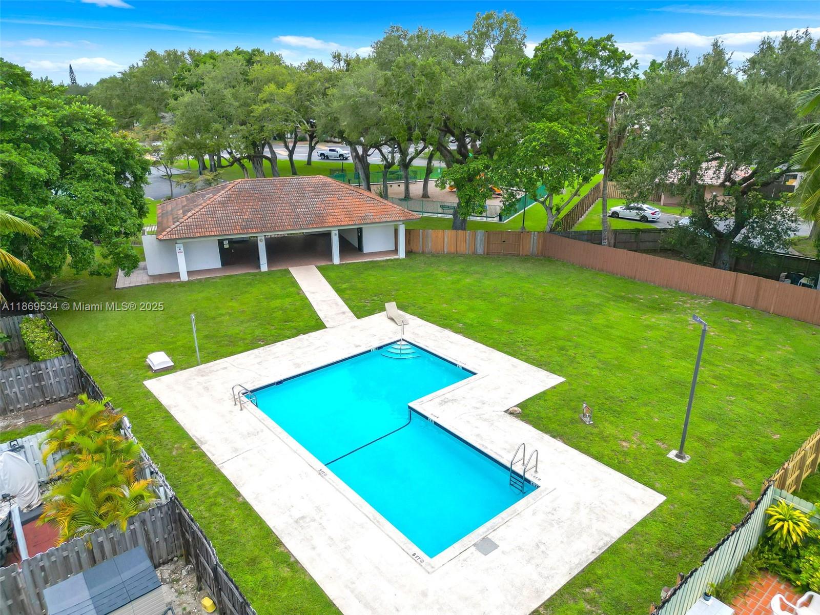 11186 Southwest 75th Terrace Miami, FL 33173 - Photo 23 of 26 a view of an house with backyard space and balcony