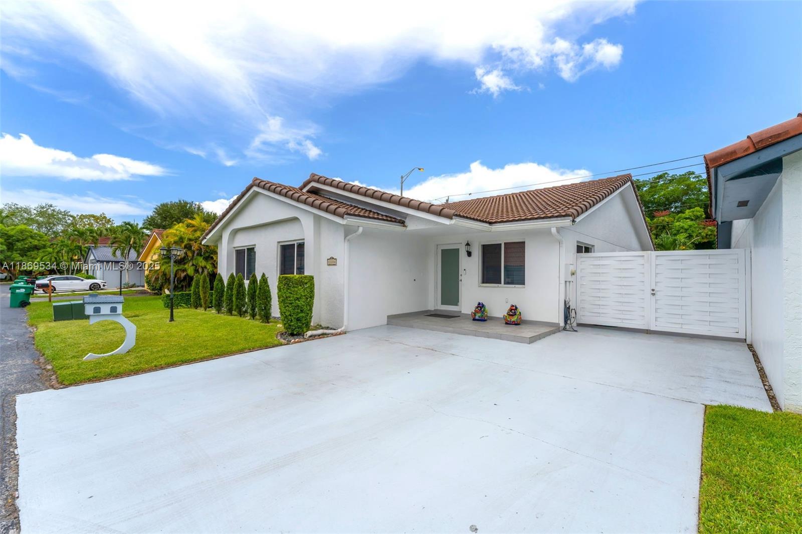11186 Southwest 75th Terrace Miami, FL 33173 - Photo 25 of 26 a view of a house with a patio and a yard